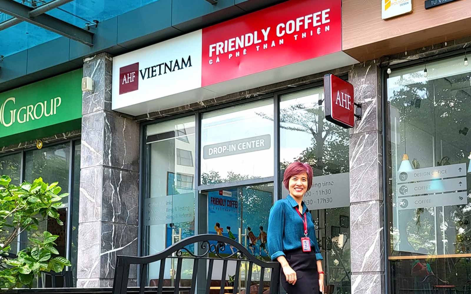 AHF Vietnam's Staff pausing in front of the Friendly Café entrance
